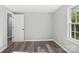 Well-lit bedroom with a large window and gray walls at 2091 & 2095 Catawba River Rd, Fort Lawn, SC 29714