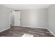 Spacious bedroom with grey walls, wood-look flooring, and an interior door at 2091 & 2095 Catawba River Rd, Fort Lawn, SC 29714