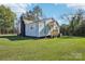 Cute blue house with wooden steps and a spacious lawn at 2091 & 2095 Catawba River Rd, Fort Lawn, SC 29714