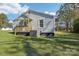 Side view of a light blue house with a wooden porch and AC unit at 2091 & 2095 Catawba River Rd, Fort Lawn, SC 29714