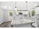 Modern kitchen with white cabinets, granite countertops, and stainless steel appliances at 2091 & 2095 Catawba River Rd, Fort Lawn, SC 29714