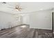 Spacious living room featuring gray vinyl flooring and a ceiling fan at 2091 & 2095 Catawba River Rd, Fort Lawn, SC 29714