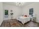 Bright bedroom with hardwood floors, stylish lighting and a door to the outdoors at 211 Brooklyn Ave, Lancaster, SC 29720