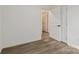 Bright bedroom with neutral paint, hardwood floors, and white doors creating a clean, modern aesthetic at 211 Brooklyn Ave, Lancaster, SC 29720