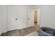 Bright bedroom with hardwood floors and a view into the hall and featuring neutral walls and modern decor at 211 Brooklyn Ave, Lancaster, SC 29720