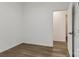 This bedroom features neutral walls, sleek hardwood flooring, and an open doorway enhancing the bright, modern feel at 211 Brooklyn Ave, Lancaster, SC 29720
