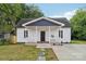 Charming exterior of a home with a inviting front porch and well-maintained lawn at 211 Brooklyn Ave, Lancaster, SC 29720