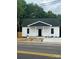 Charming home with a cozy porch and fresh landscaping, ready for its new owners to move in at 211 Brooklyn Ave, Lancaster, SC 29720