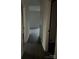 Hallway with hardwood floors, painted walls, and a white door at 211 Brooklyn Ave, Lancaster, SC 29720