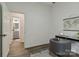 Bright home office features hardwood floors, and an open door leading to a bathroom, creating a practical workspace at 211 Brooklyn Ave, Lancaster, SC 29720