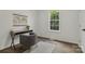 Inviting home office features a desk, a comfortable chair, hardwood floors, and a bright window offering great lighting at 211 Brooklyn Ave, Lancaster, SC 29720