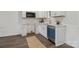 Modern kitchen featuring white cabinets, stainless steel appliances, and subway tile backsplash at 211 Brooklyn Ave, Lancaster, SC 29720