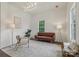 Bright living room featuring stylish furnishings, neutral color palette, and lots of natural light at 211 Brooklyn Ave, Lancaster, SC 29720