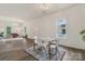Open-concept living space with hardwood floors, abundant natural light, and modern furnishings at 211 Brooklyn Ave, Lancaster, SC 29720