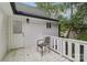 Inviting side porch with white railing and door, perfect for enjoying the outdoors at 211 Brooklyn Ave, Lancaster, SC 29720