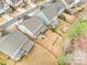 An aerial view of the home showing the backyard, deck, screened-in porch and landscaping at 2201 Bluebell Way, Tega Cay, SC 29708