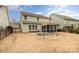 Fenced backyard with a screened-in porch and raised garden, perfect for outdoor living at 2201 Bluebell Way, Tega Cay, SC 29708