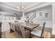 A dining room featuring a rustic wooden table with bench seating and decor that complements the light gray walls at 2201 Bluebell Way, Tega Cay, SC 29708