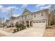 Charming two-story home with attached two car garage and manicured front lawn at 2201 Bluebell Way, Tega Cay, SC 29708