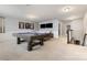 This game room includes a pool table, carpet and large television at 2201 Bluebell Way, Tega Cay, SC 29708