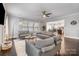 Inviting living room with hardwood floors, neutral decor, and open layout to dining and kitchen at 2201 Bluebell Way, Tega Cay, SC 29708