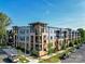 Modern apartment building with ample parking and landscaped grounds at 2401 Euclid Ave # 110, Charlotte, NC 28203