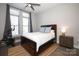 Bright bedroom with a double bed, exercise bike, and large windows at 2401 Euclid Ave # 110, Charlotte, NC 28203
