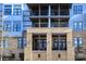 Modern building exterior with light blue and tan accents at 2401 Euclid Ave # 110, Charlotte, NC 28203