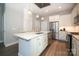 Modern kitchen with white cabinets, stainless steel appliances, and quartz countertops at 2401 Euclid Ave # 110, Charlotte, NC 28203