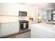 Modern kitchen with stainless steel appliances and white shaker cabinets at 2401 Euclid Ave # 110, Charlotte, NC 28203