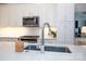 Sleek kitchen island with quartz countertop and modern sink fixture at 2401 Euclid Ave # 110, Charlotte, NC 28203