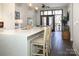 Open kitchen island with seating and view into the living area at 2401 Euclid Ave # 110, Charlotte, NC 28203