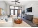Spacious living room featuring a sectional sofa, hardwood floors, and access to a balcony at 2401 Euclid Ave # 110, Charlotte, NC 28203