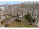 Aerial view of the home with a lakeside setting and mature trees at 2498 Smith Harbour Dr, Denver, NC 28037