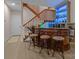 Basement bar area with custom wood bar, barstool seating and decorative lighting at 2498 Smith Harbour Dr, Denver, NC 28037