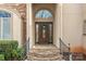 Elegant front door with stone steps, a decorative wreath, and sidelights at 2498 Smith Harbour Dr, Denver, NC 28037