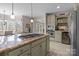 Spacious kitchen featuring a large center island with cooktop, granite countertops, and stainless steel appliances at 2498 Smith Harbour Dr, Denver, NC 28037