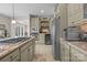 Spacious kitchen with stainless steel appliances, granite countertops, built-in wine rack, and ample storage space at 2498 Smith Harbour Dr, Denver, NC 28037