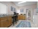 Bright laundry room with sink, built-in cabinets, and workspace at 2498 Smith Harbour Dr, Denver, NC 28037