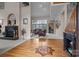 Spacious living room featuring hardwood floors with decorative inlay, fireplace, and ample natural light at 2498 Smith Harbour Dr, Denver, NC 28037