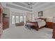Spacious main bedroom with a trey ceiling, sitting area, and large windows at 2498 Smith Harbour Dr, Denver, NC 28037