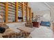 Bright office space with custom bookshelves filled with airplane models and a cozy sitting area at 2498 Smith Harbour Dr, Denver, NC 28037