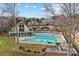 Lovely community pool nestled near waterfront homes, offering a refreshing retreat with picturesque lake views and charming landscaping at 2498 Smith Harbour Dr, Denver, NC 28037
