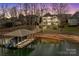 Waterfront home with boat dock along sandy shore, perfect for lake living at 2498 Smith Harbour Dr, Denver, NC 28037