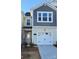 Two-story home showcasing a neutral color scheme, well-manicured landscaping, and an attached garage at 256 Laura Elizabeth Ln, Clover, SC 29710