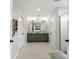 Well-lit main bathroom with double sinks, tile floors, and a separate shower at 3041 Winged Teal Ct, Belmont, NC 28012