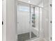 The main bathroom boasts a glass enclosed shower with built in bench and tiled walls at 3041 Winged Teal Ct, Belmont, NC 28012