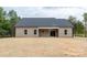 The rear of the house has sliding glass doors which lead to a large covered patio at 3089 Meadowcrest Dr # 28, Clover, SC 29710