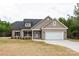 Inviting single-story home with a two-car garage, a well-lit entrance, and ample yard space at 3089 Meadowcrest Dr # 28, Clover, SC 29710