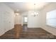 Bright dining room with hardwood floors and chandelier at 3139 Pinehills Way, Mount Holly, NC 28120